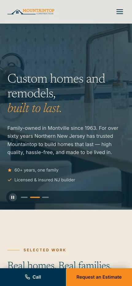 The rebuilt Mountaintop homepage on a phone: “Custom homes and remodels, built to last”, family-owned in Montville since 1963, sixty-plus years and one family, licensed and insured NJ builder, over a kitchen photograph