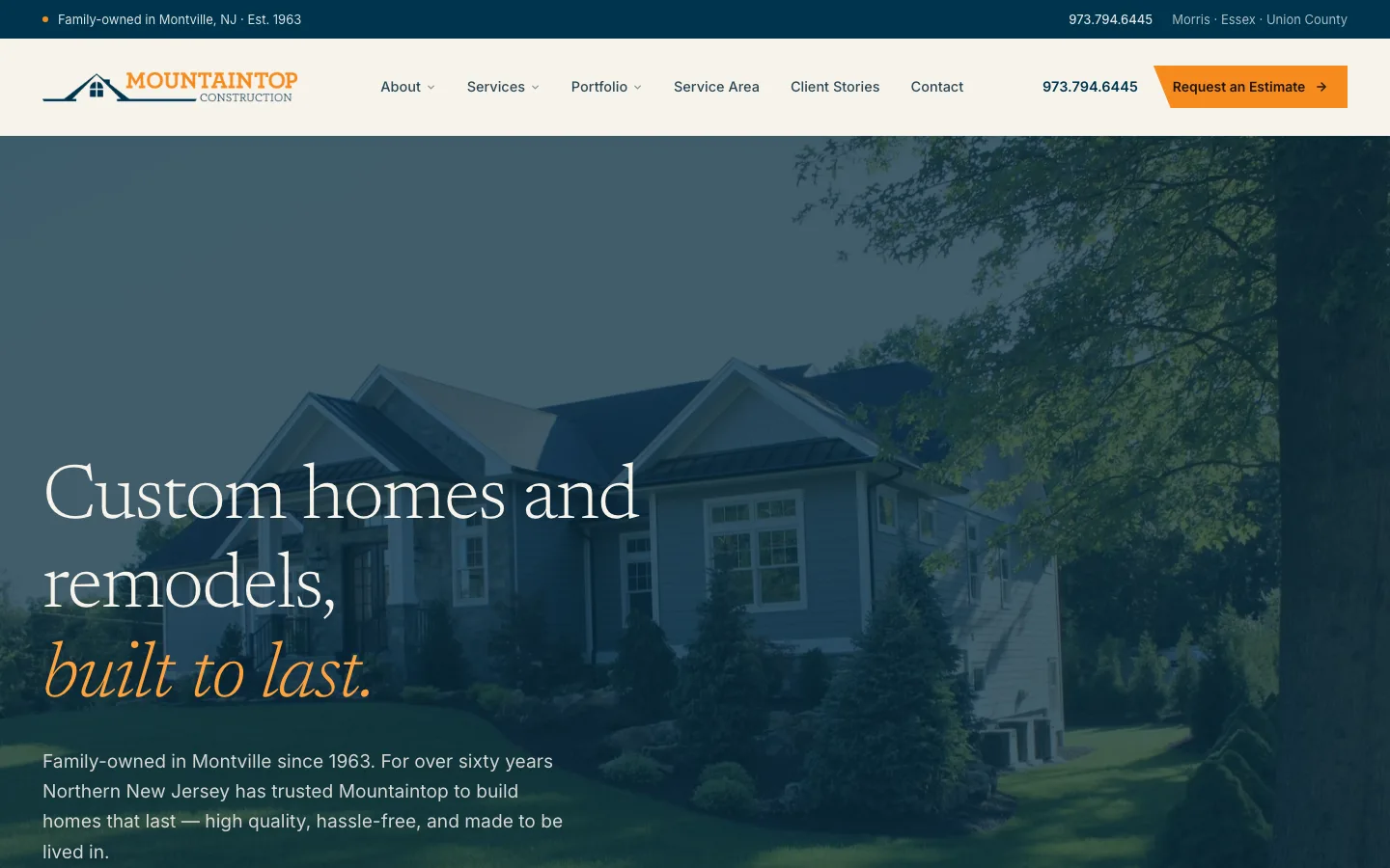 The Mountaintop Construction website, showing a custom homes headline over a photograph of a finished property