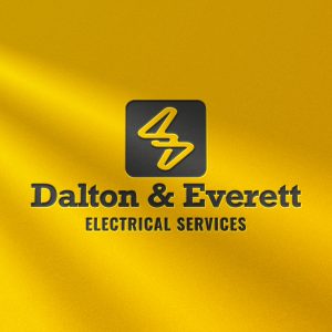 Dalton & Everett Electrical Services logo embossed on a yellow surface